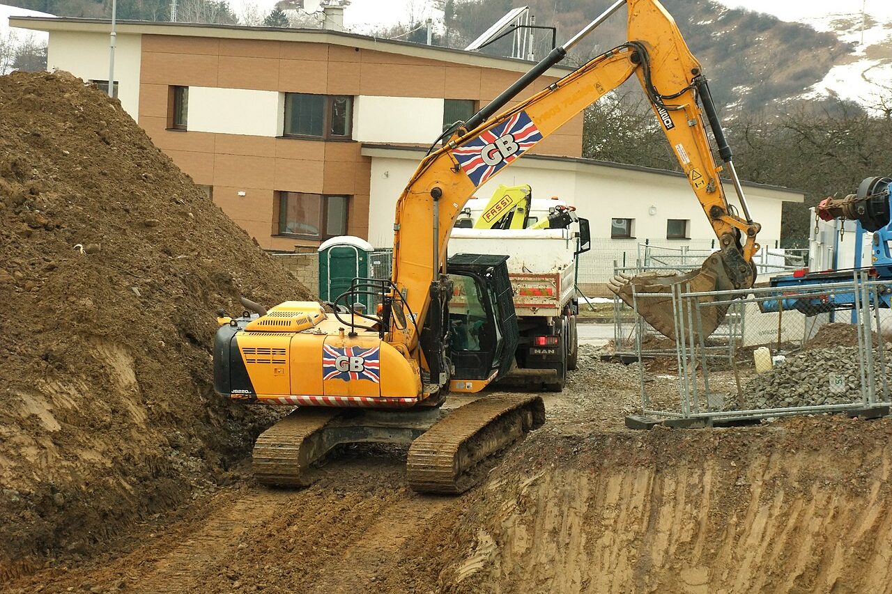 JCB tracked excavator digging on a construction site