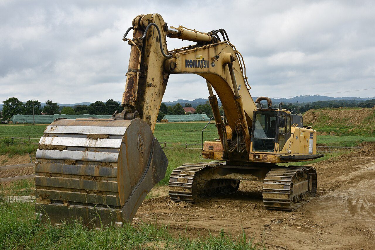Large Komatsu mass-excavation excavator with bucket raised